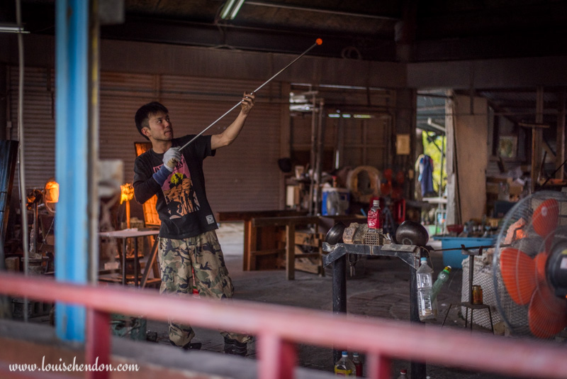 yomitan pottery village man blowing glass okinawa japan photos