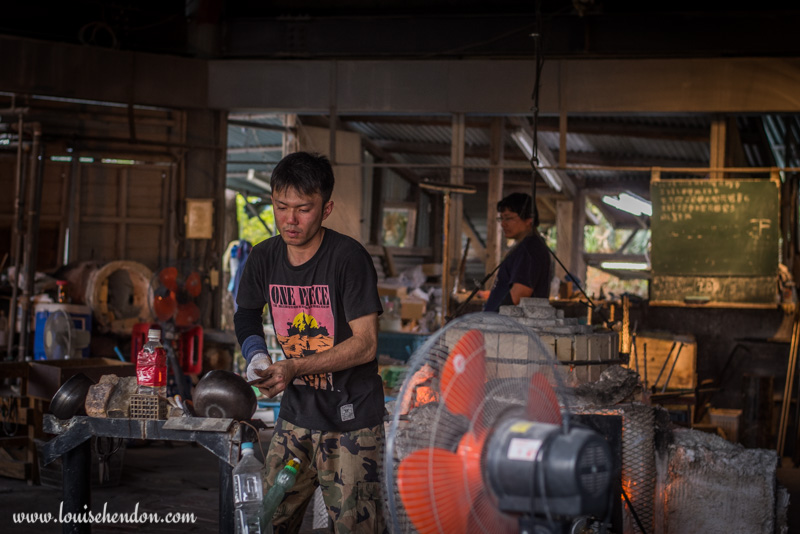 yomitan pottery village man blowing glass okinawa japan photos